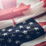 Flags of usa and canada Fiber optic cables connecting remote areas